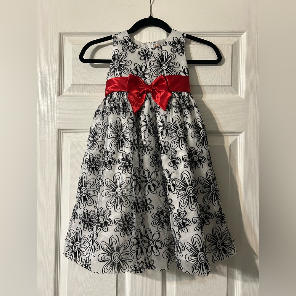 Fancy black and white dress with sparkles and red bow